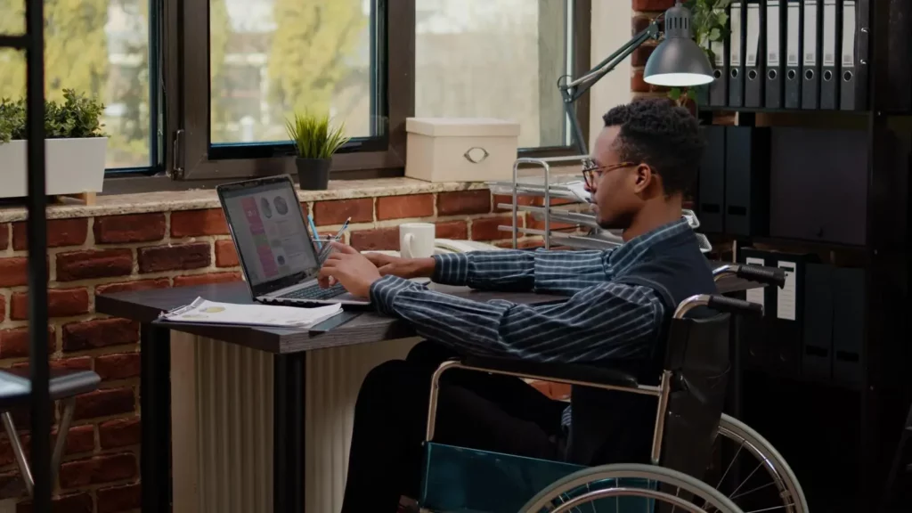 A disabled person using a laptop