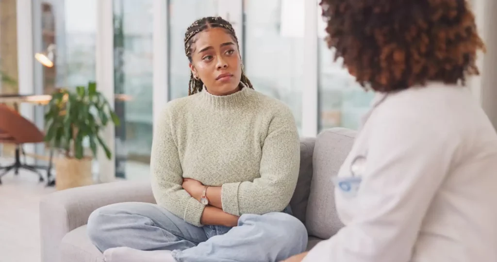 woman with anxiety at the therapy session