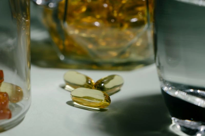 A close-up of omega-3 supplements, which are often recommended as an alternative to Adderall for improving cognitive function, focus, and brain health, offering a natural approach to managing symptoms of ADHD.