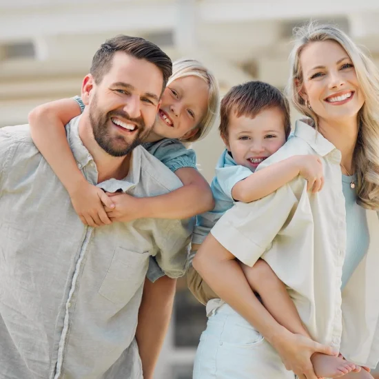 parents-giving-kids-piggyback-rides